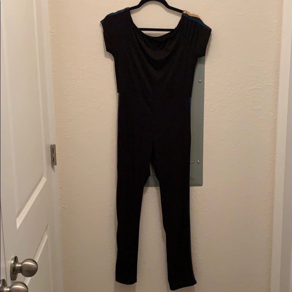 Black jumpsuit with green and yellow trim